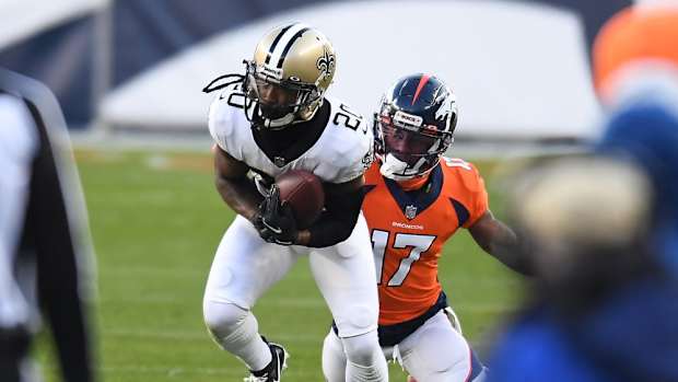 New Orleans Saints cornerback Janoris Jenkins (20) intercepts a pass intended for Denver Broncos wide receiver DaeSean Hamilton (17) in the second quarter at Empower Field at Mile High.